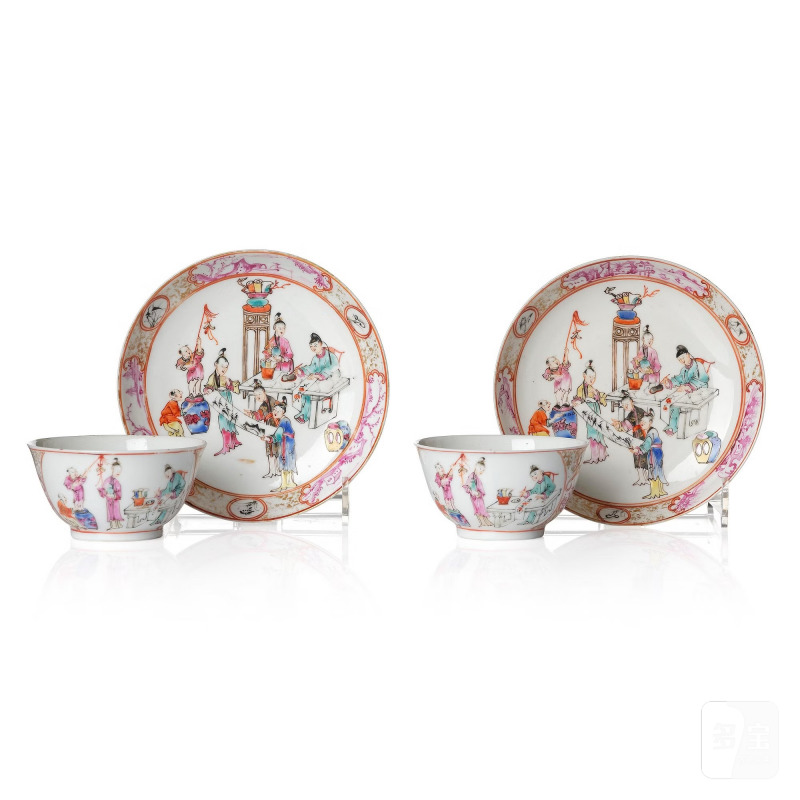 A pair of famille rose 'figural' tea cups with saucers,
